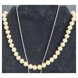 Vintage Jewelry Lot Including Pearl Necklace, Cross Pendant, and Silver Bracelet