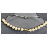 Vintage Jewelry Lot Including Pearl Necklace, Cross Pendant, and Silver Bracelet