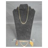 Collection of Gold Tone and Vintage Jewelry Including Gold Tone Chain, Brooch, and Pendants