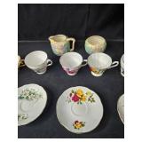 Collection of Vintage Bone China Tea Cups, Plates, and Creamers