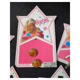 LOT OF BARBIE CHARMS AND RINGS ON ORIGINAL PACKAGE
