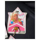LOT OF BARBIE CHARMS AND RINGS ON ORIGINAL PACKAGE