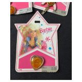 LOT OF BARBIE CHARMS AND RINGS ON ORIGINAL PACKAGE