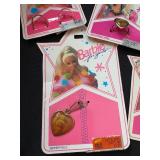 LOT OF BARBIE CHARMS AND RINGS ON ORIGINAL PACKAGE