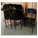 Four Black Folding Chairs