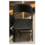 Four Black Metal Folding Chairs