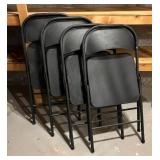Four Black Metal Folding Chairs