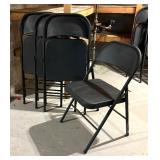 Four Black Folding Chairs