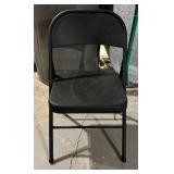 Four Black Folding Chairs