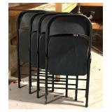 Four Black Folding Chairs