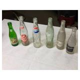 Collection of Vintage Soda Bottles with Coca-Cola Carrier