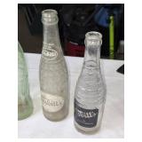 Collection of Vintage Soda Bottles with Coca-Cola Carrier