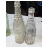 Collection of Vintage Soda Bottles with Coca-Cola Carrier