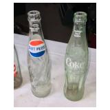Collection of Vintage Soda Bottles with Coca-Cola Carrier