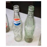 Collection of Vintage Soda Bottles with Coca-Cola Carrier