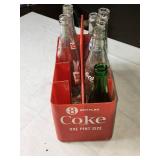 Collection of Vintage Soda Bottles with Coca-Cola Carrier