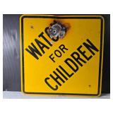 Watch for Children Traffic Safety Sign with Visible Damage