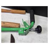 Collection of Gardening Tools Including Weed Cutter, Pruning Shears, and Hand Tools