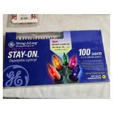 Mixed Lot of Holiday Items - DVDs, Lights, Photo Camera, and Decorations