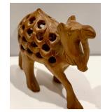 Collection of Four Wooden Camel Figurines