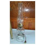 Vintage Wooden Stool and Electrified Oil Lamp.