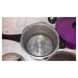 Assorted Cookware Collection including Pots, Pans, and Kettles