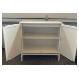 White Cabinet with Rattan Accents