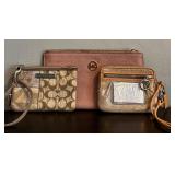 Two Coach Wristlets and a Michael Kors Wristlet