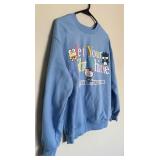 Two Blue Sweatshirts Including Peanuts and Hello Kitty