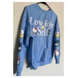 Two Blue Sweatshirts Including Peanuts and Hello Kitty