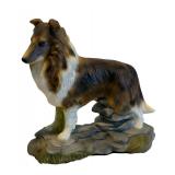 Three Collectible Dog Figurines