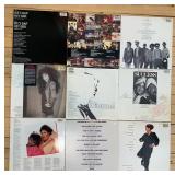 Collection of 9 Vinyl Record Albums with Mixed Genres including Isaac Hayes