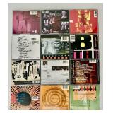 Collection of 12 Classic Rock CDs Featuring Pearl Jam, R.E.M., and INXS
