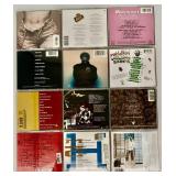Collection of 12 Music CDs Featuring Various Artists including Janet Jackson and Elvis Presley