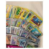 Collection of 200 Pokemon Trading Cards with Rare Holographic and Sleeves