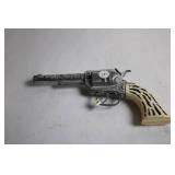 Vintage Cap Gun with Ornate Details and Ivory-Look Handle
