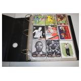 Collection of Sports Trading Cards in Binder, Featuring Various Sports and Players