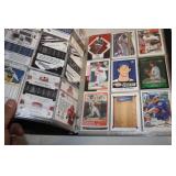 Collection of Sports Trading Cards in Binder, Featuring Various Sports and Players