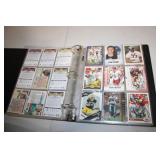 Collection of Sports Trading Cards in Binder, Featuring Various Sports and Players