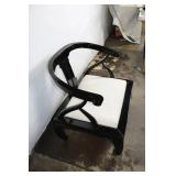 Elegant Black Armchair with Cream Cushion