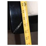 Elegant Black Armchair with Cream Cushion