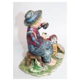 Vintage Porcelain Figurine of Boy Feeding Puppy