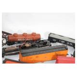 Collection of Vintage Model Train Cars and Accessories