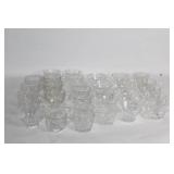Collection of 32 Vintage Clear Glass Tea Cups with Intricate Designs