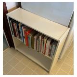 Collection of Cookbooks and White Shelf