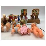 Collection of Vintage Miniature Dolls and Toy Tea Set with Floral Design