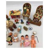 Collection of Vintage Miniature Dolls and Toy Tea Set with Floral Design
