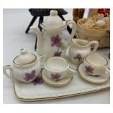 Collection of Vintage Miniature Dolls and Toy Tea Set with Floral Design