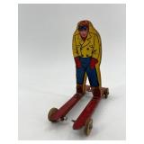 Vintage Wolverine Tin Skier Toy