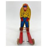 Vintage Wolverine Tin Skier Toy